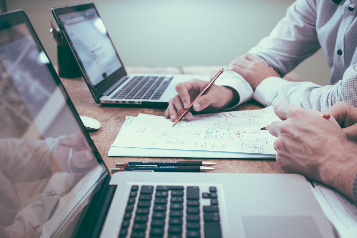 Advisors reviewing strategy documents at a desk